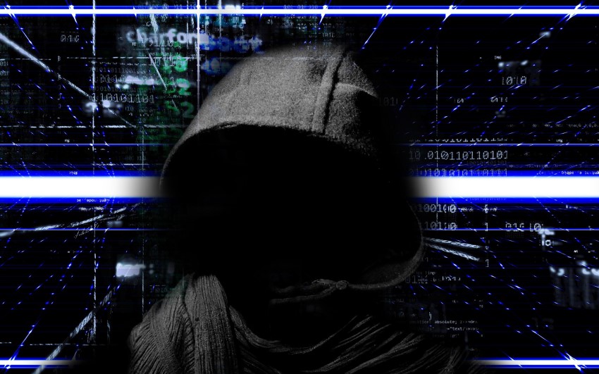 person dressed in a hood like a hacker